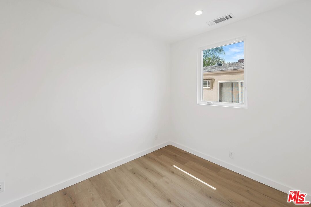 510 East Palmer Avenue Glendale, CA 91205 - Photo 23 of 26 a view of an empty room with wooden floor and a window