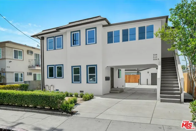 a front view of a house with garage