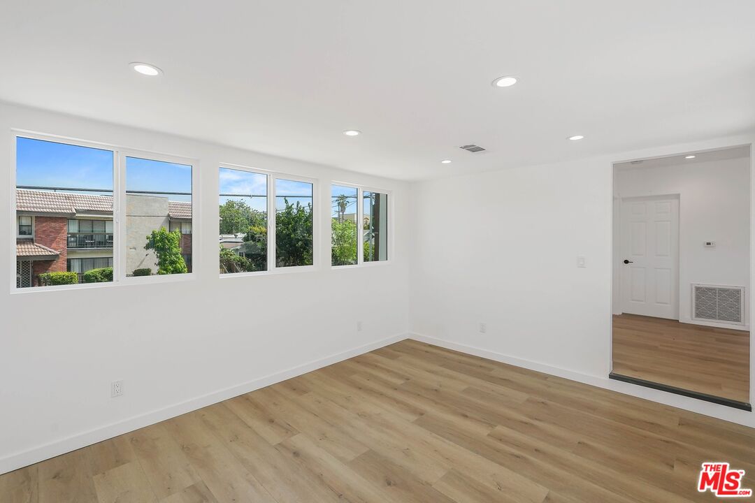 510 East Palmer Avenue Glendale, CA 91205 - Photo 3 of 26 a view of an empty room with wooden floor and a window