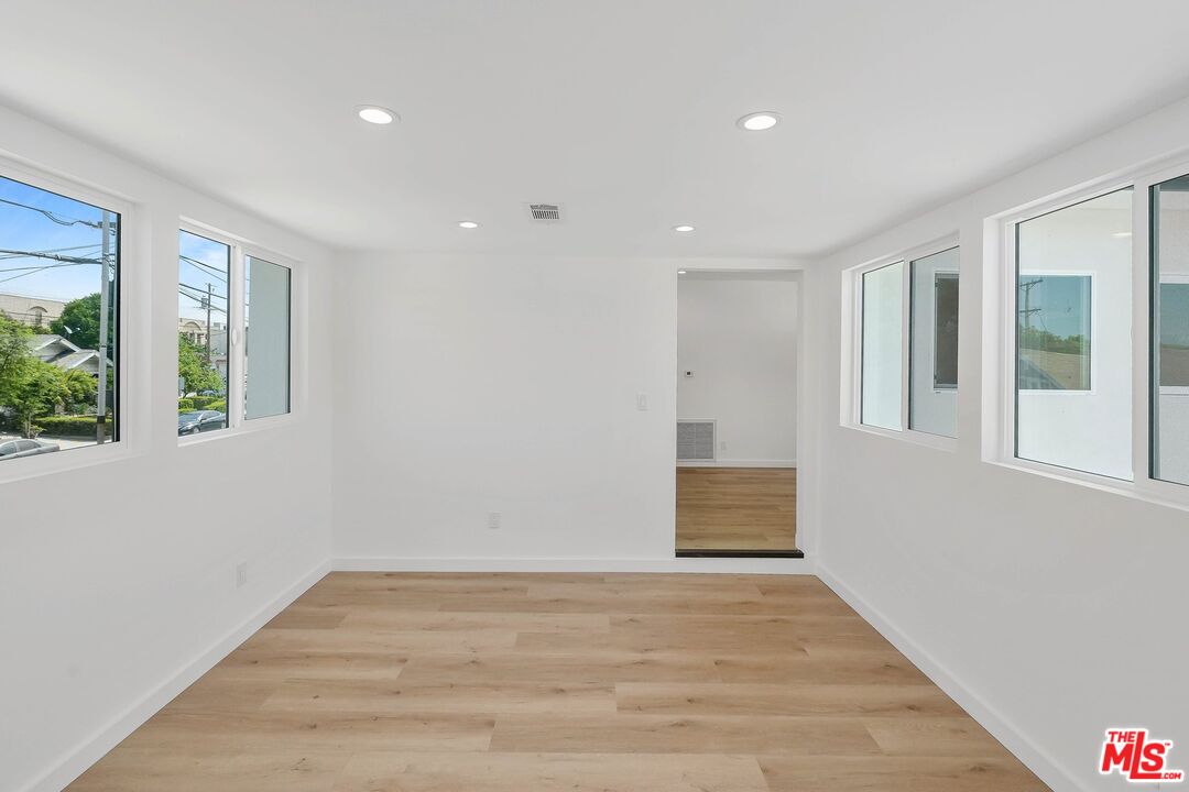 510 East Palmer Avenue Glendale, CA 91205 - Photo 4 of 26 a view of an empty room with wooden floor and a window