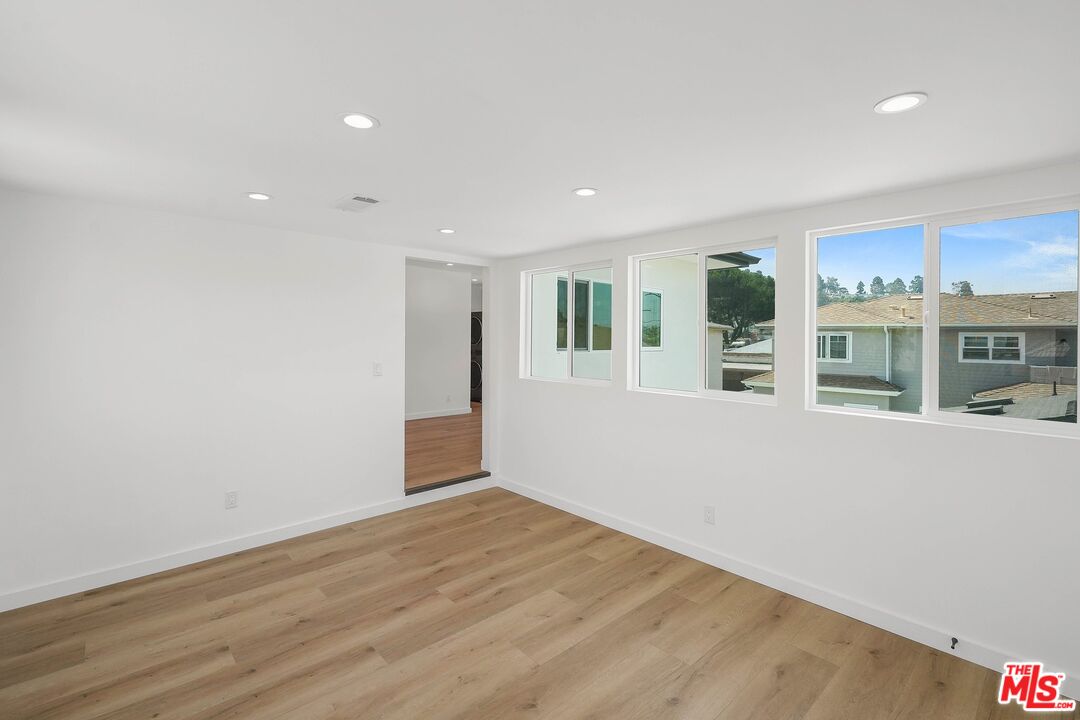 510 East Palmer Avenue Glendale, CA 91205 - Photo 5 of 26 a view of a big room with wooden floor and windows