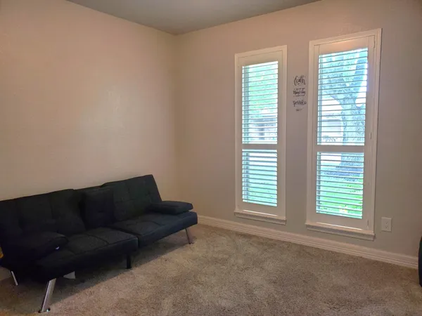 a bathroom with a granite countertop toilet a sink and a mirror