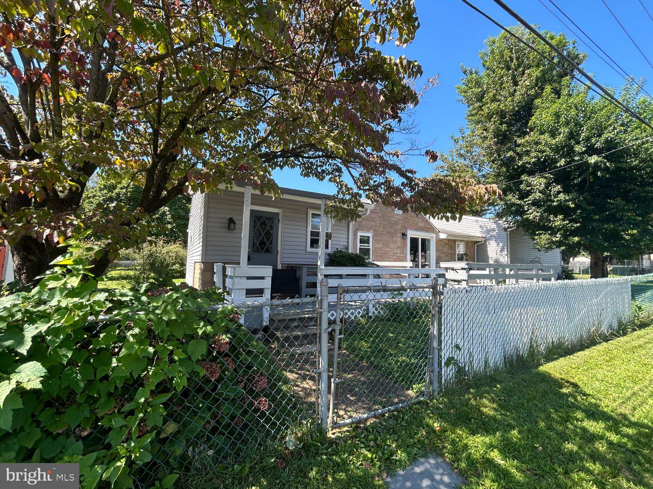 434 Sycamore Avenue Croydon, PA 19021 - Photo 1 of 26 a view of a yard in front of a house with plants and large tree
