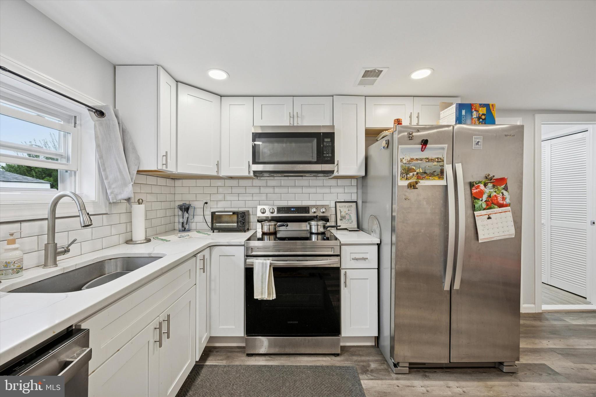 434 Sycamore Avenue Croydon, PA 19021 - Photo 11 of 26 a kitchen with a sink stove and refrigerator