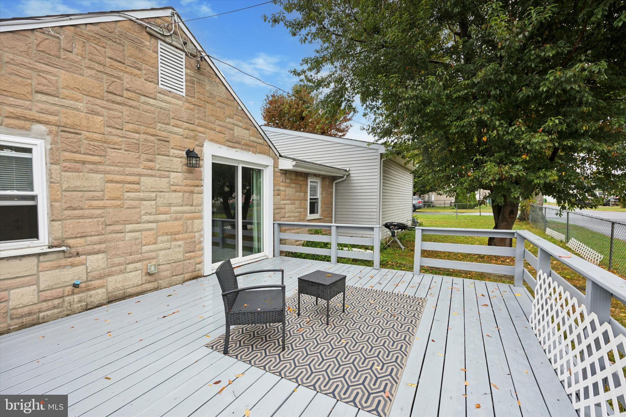 434 Sycamore Avenue Croydon, PA 19021 - Photo 12 of 26 a view of a deck with table and chairs and wooden floor