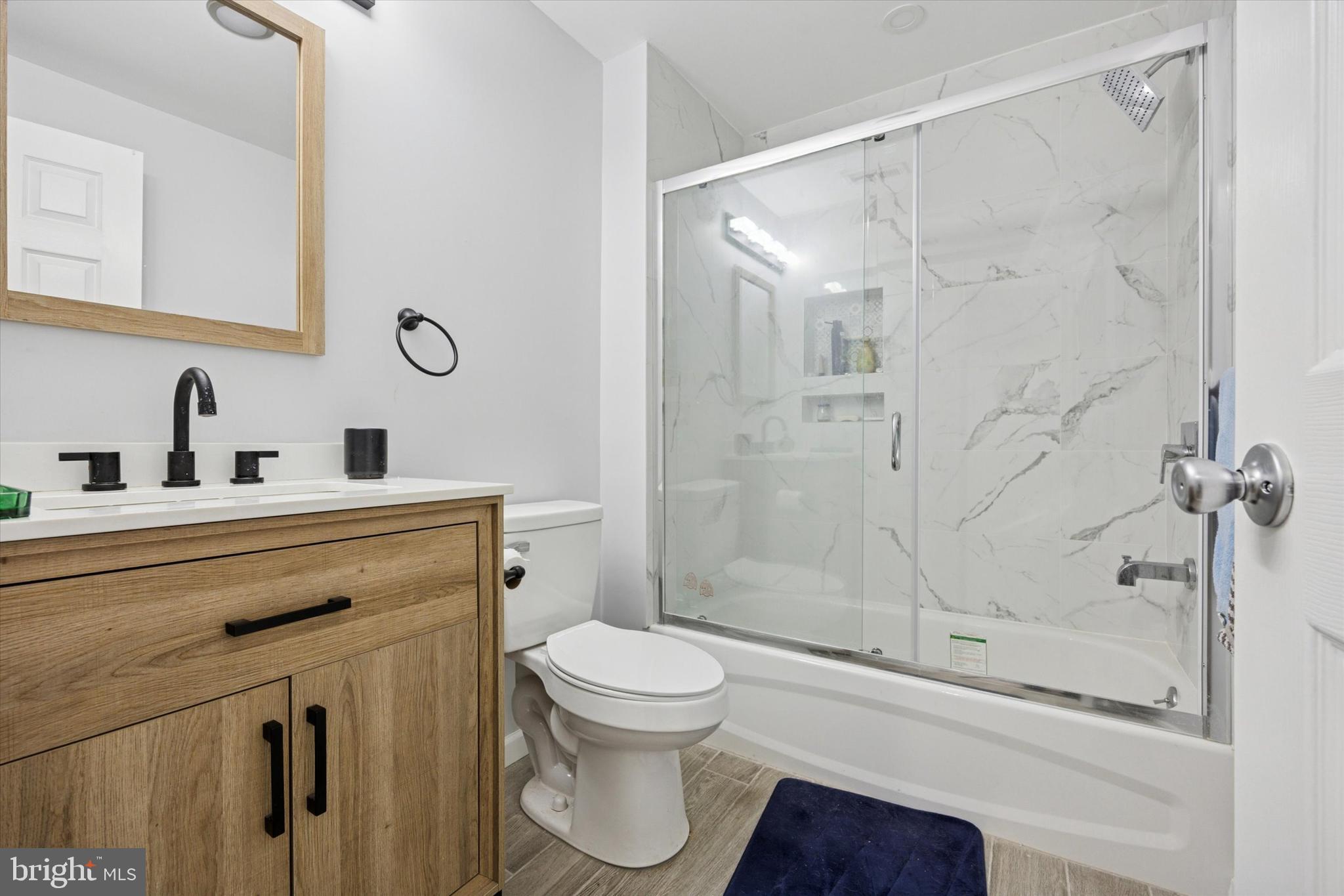 434 Sycamore Avenue Croydon, PA 19021 - Photo 19 of 26 a bathroom with a toilet sink and a shower