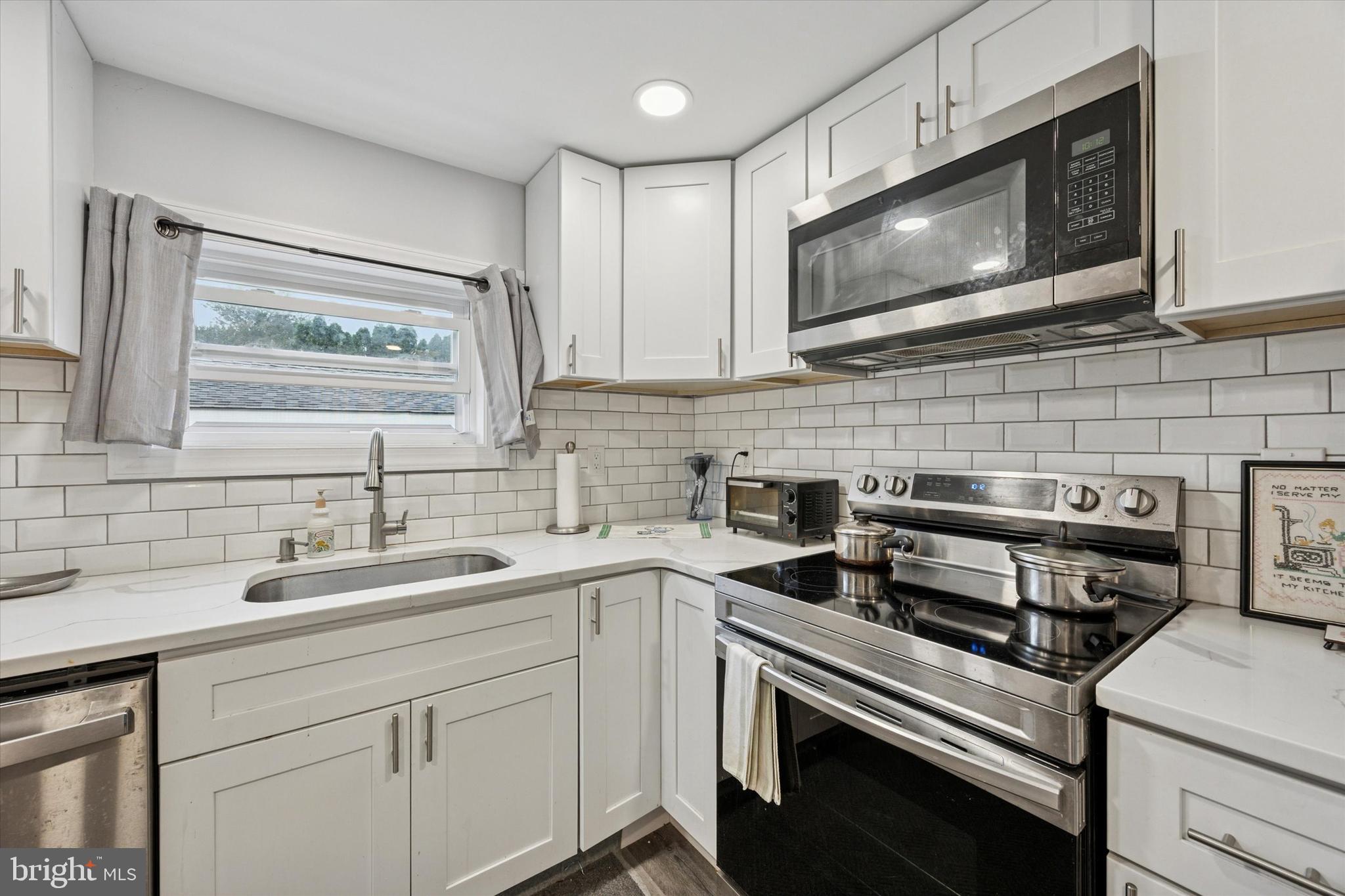 434 Sycamore Avenue Croydon, PA 19021 - Photo 9 of 26 a kitchen with a sink stove and microwave
