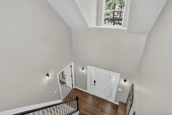 a view of an entryway with wooden floor