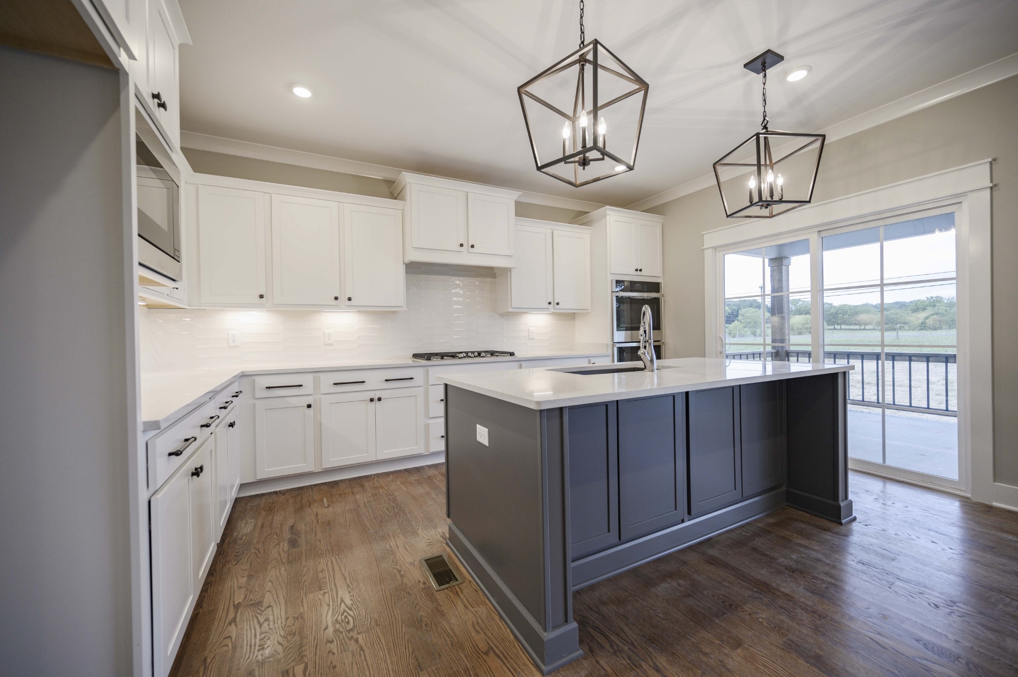 11801 North Milton Road Milton, TN 37118 - Photo 20 of 48 a kitchen with granite countertop cabinets a sink a window and stainless steel appliances