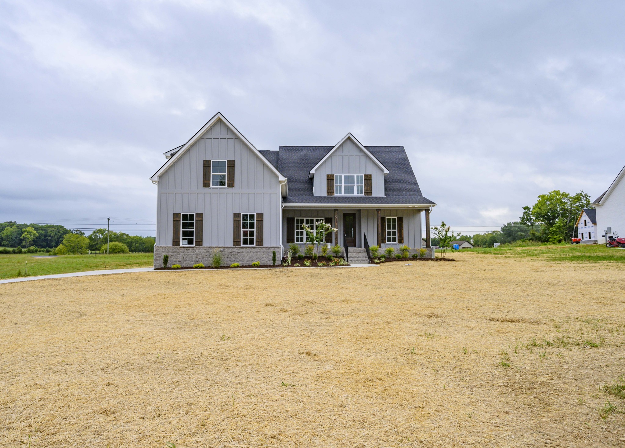 11801 North Milton Road Milton, TN 37118 - Photo 3 of 48 a front view of house with yard and trees in the background
