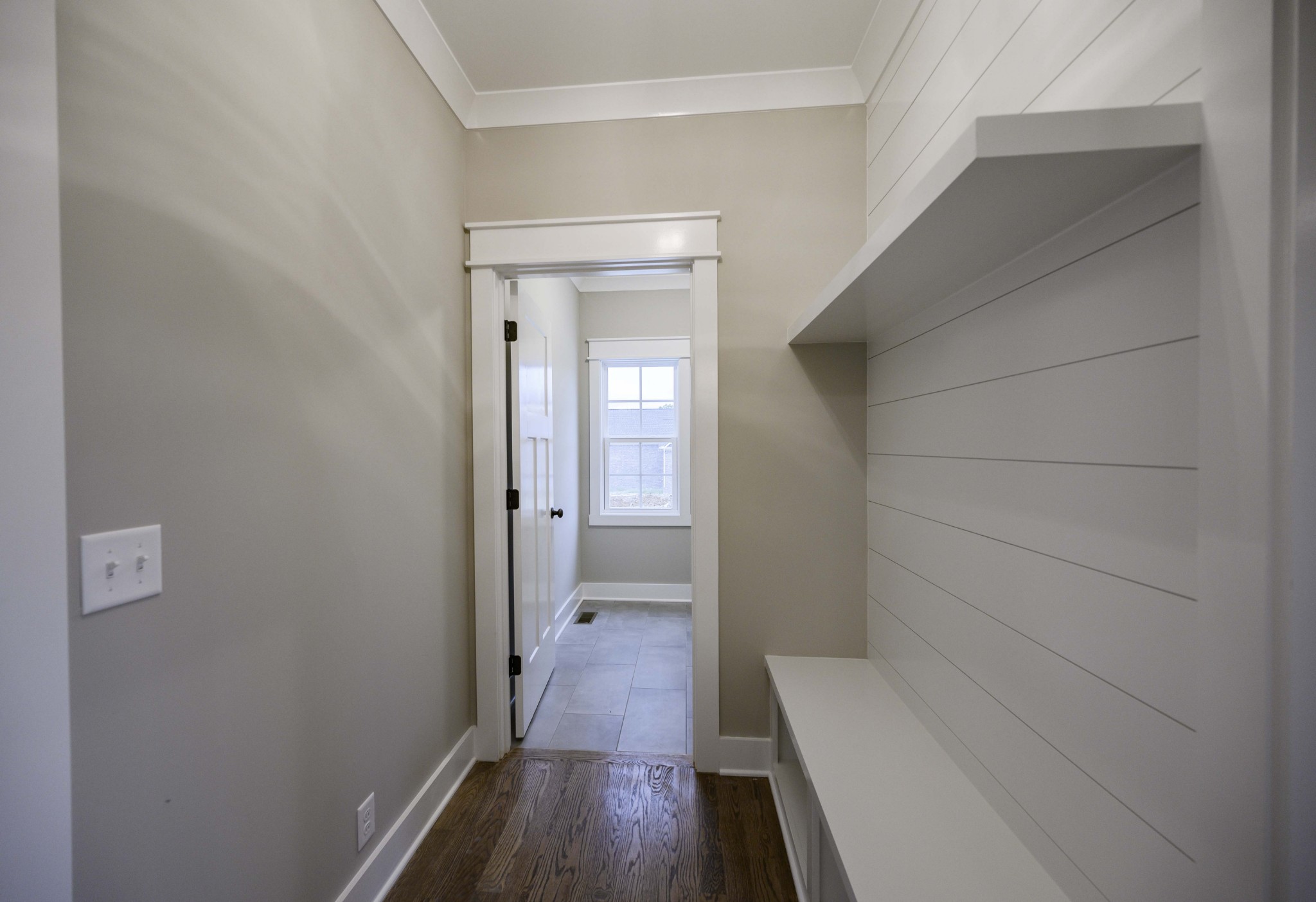 11801 North Milton Road Milton, TN 37118 - Photo 22 of 48 a view of a hallway with wooden floor and a bathroom