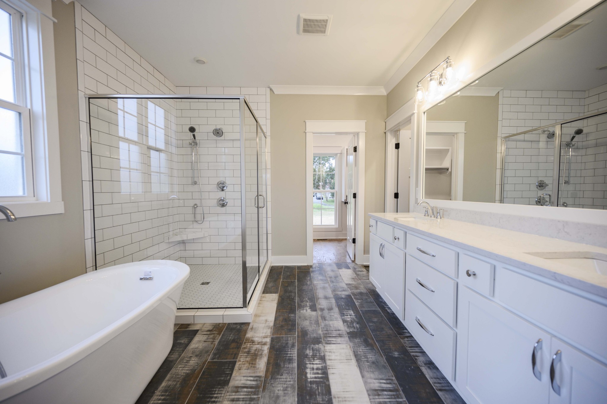 11801 North Milton Road Milton, TN 37118 - Photo 25 of 48 a spacious bathroom with a sink a mirror a bathtub and a shower
