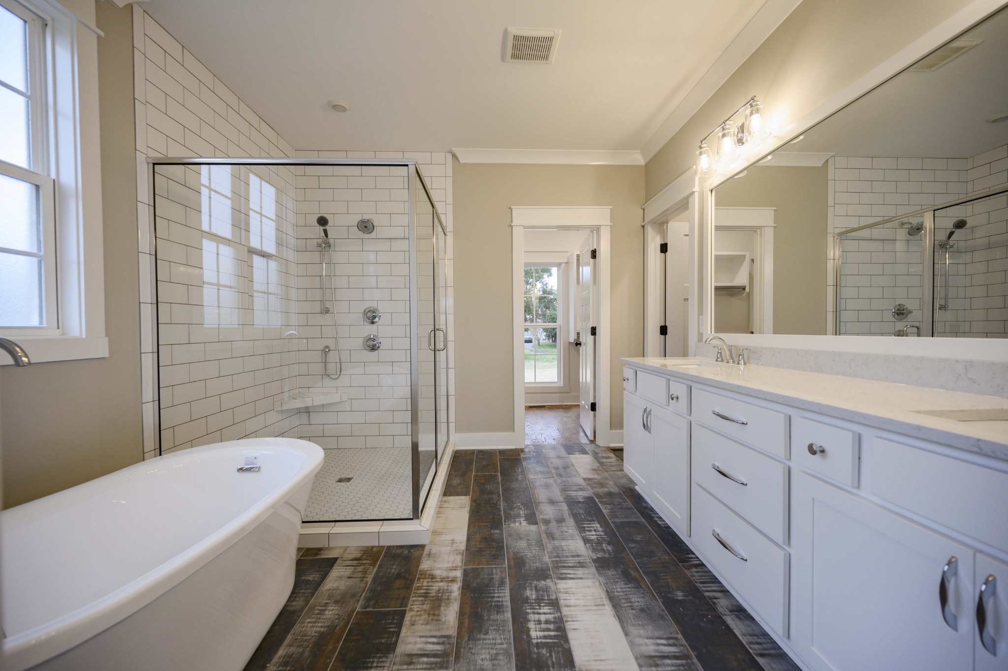 11801 North Milton Road Milton, TN 37118 - Photo 26 of 48 a bathroom with a double vanity sink toilet a shower and a bathtub