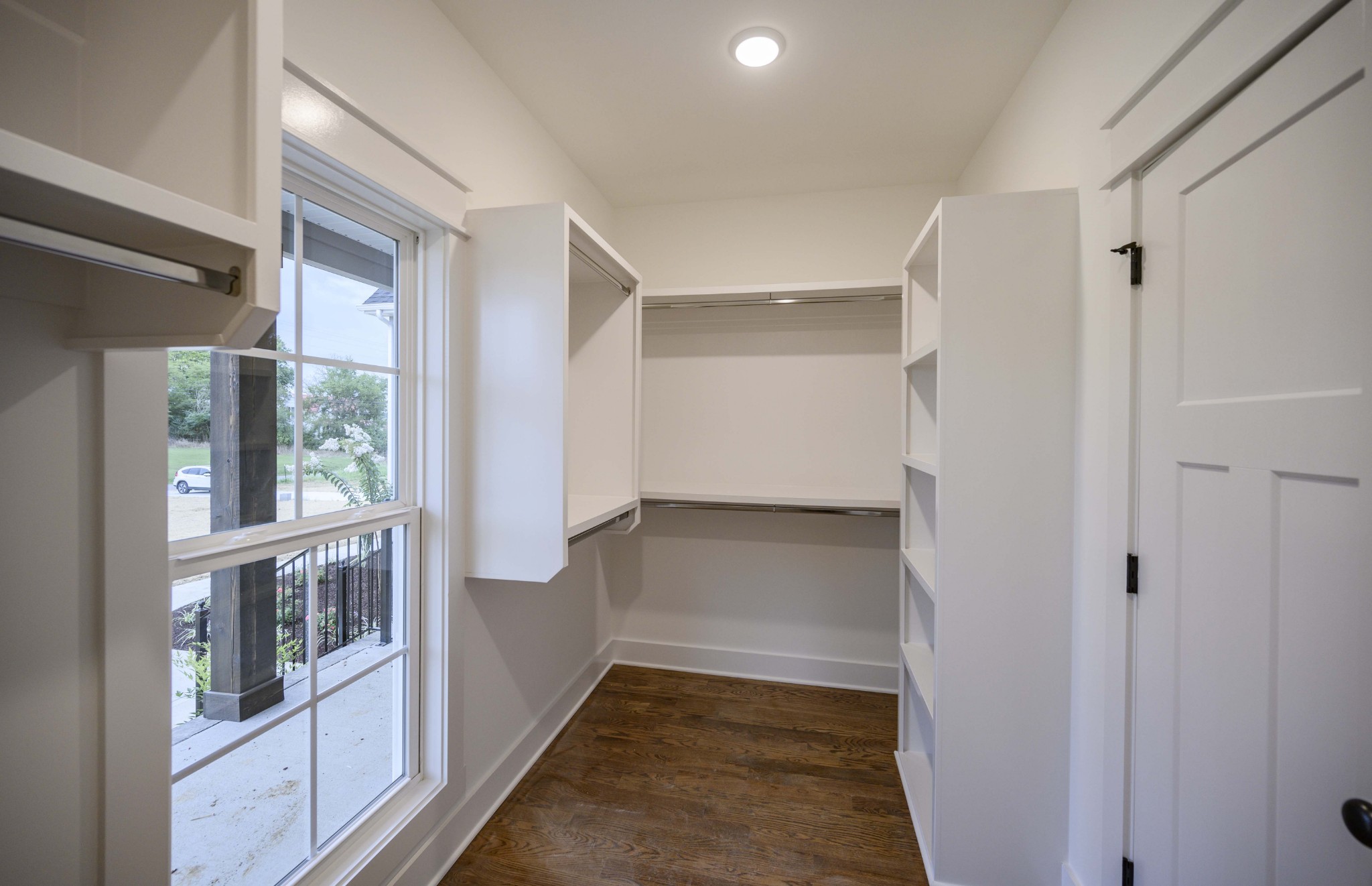 11801 North Milton Road Milton, TN 37118 - Photo 28 of 48 a view of walk in closet with wooden floor and windows