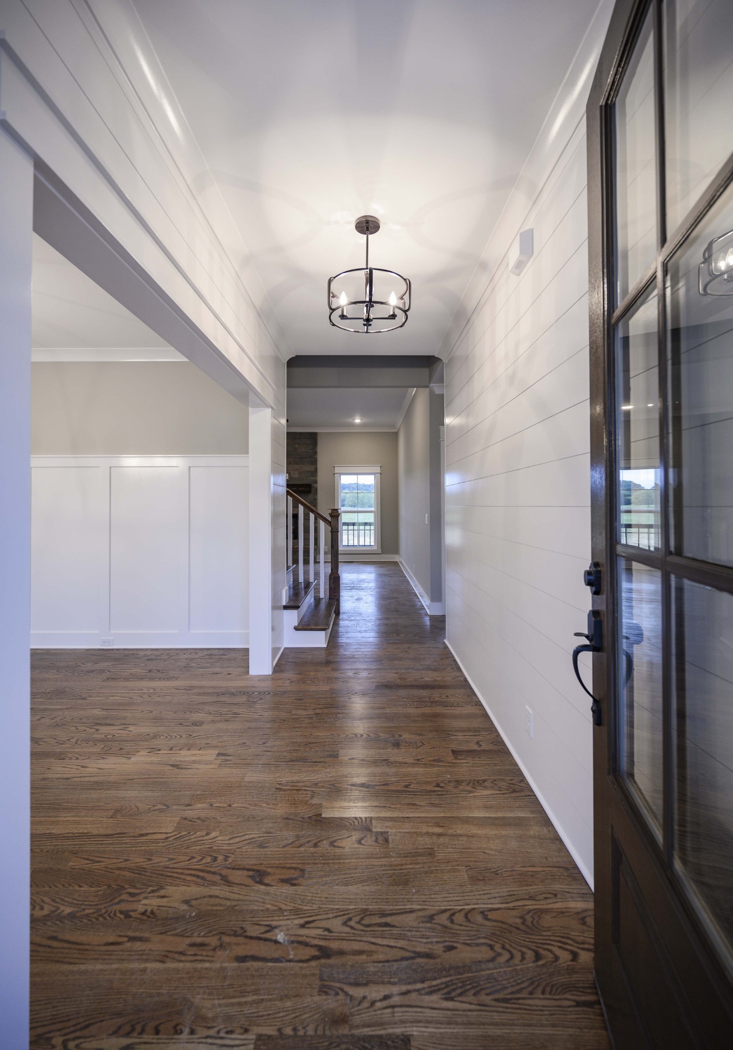 11801 North Milton Road Milton, TN 37118 - Photo 32 of 48 a view of a hallway view with wooden floor and a chandelier