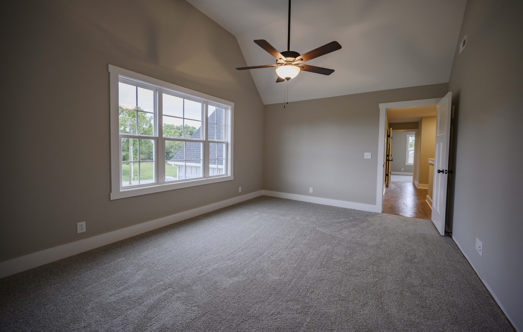 11801 North Milton Road Milton, TN 37118 - Photo 34 of 48 an empty room with a chandelier fan and windows