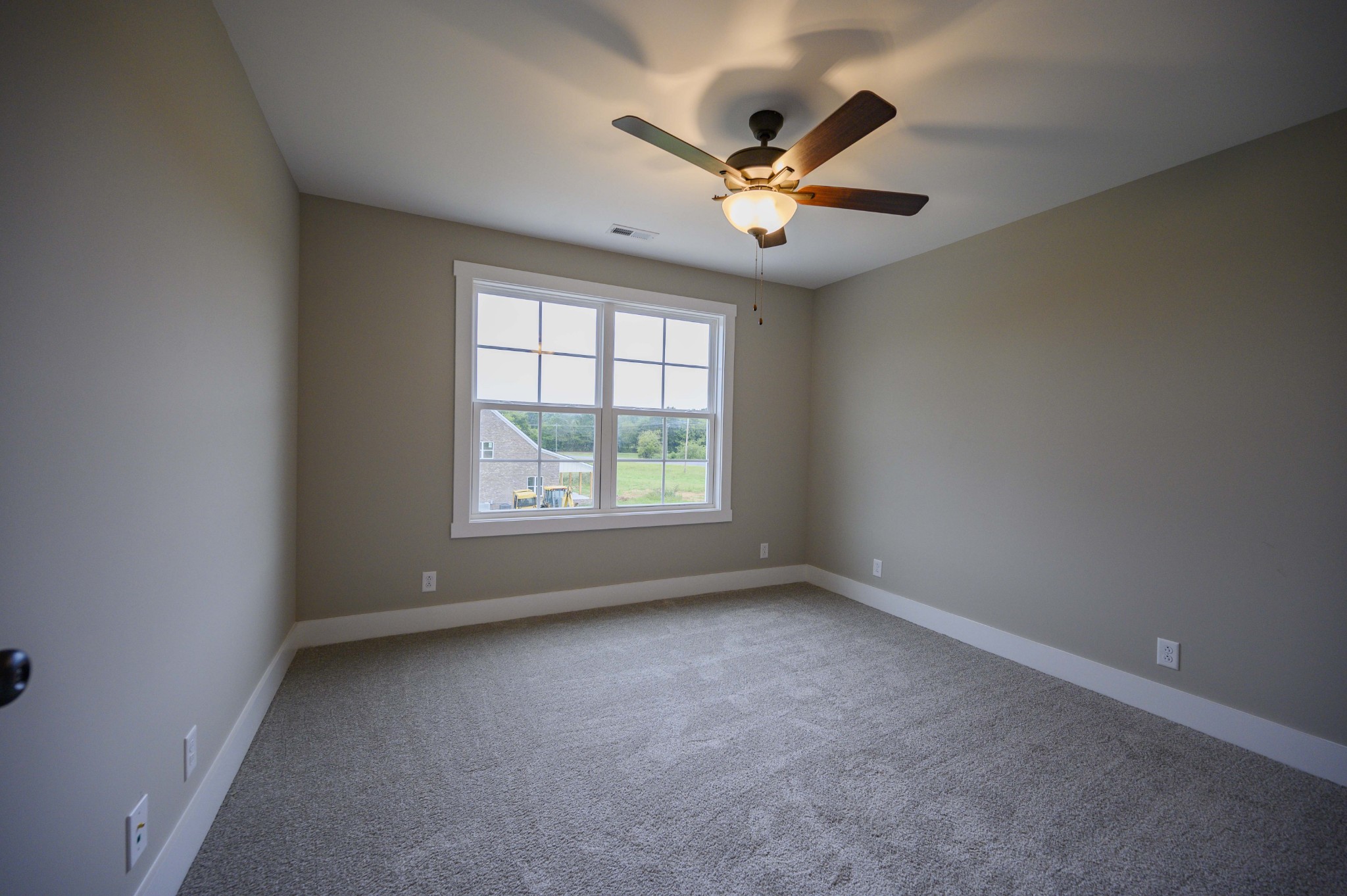 11801 North Milton Road Milton, TN 37118 - Photo 39 of 48 an empty room with windows and fan