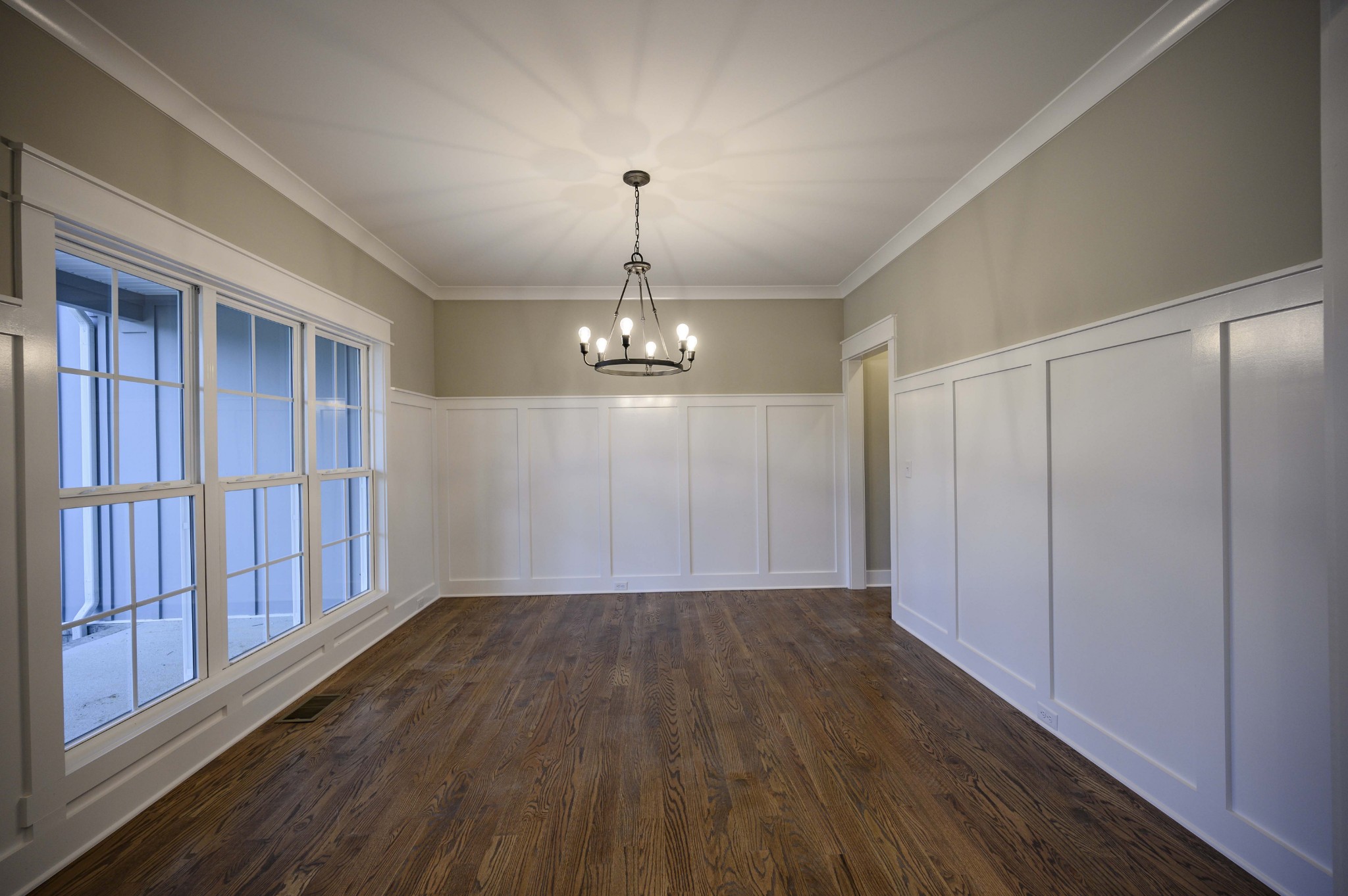 11801 North Milton Road Milton, TN 37118 - Photo 6 of 48 an empty room with wooden floor chandelier and windows