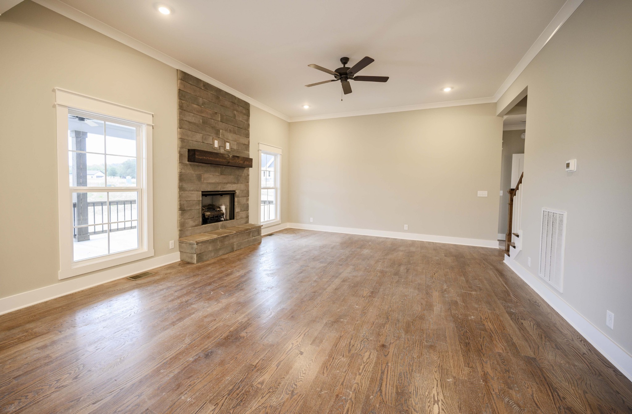 11801 North Milton Road Milton, TN 37118 - Photo 10 of 48 a view of empty room with wooden floor and fireplace