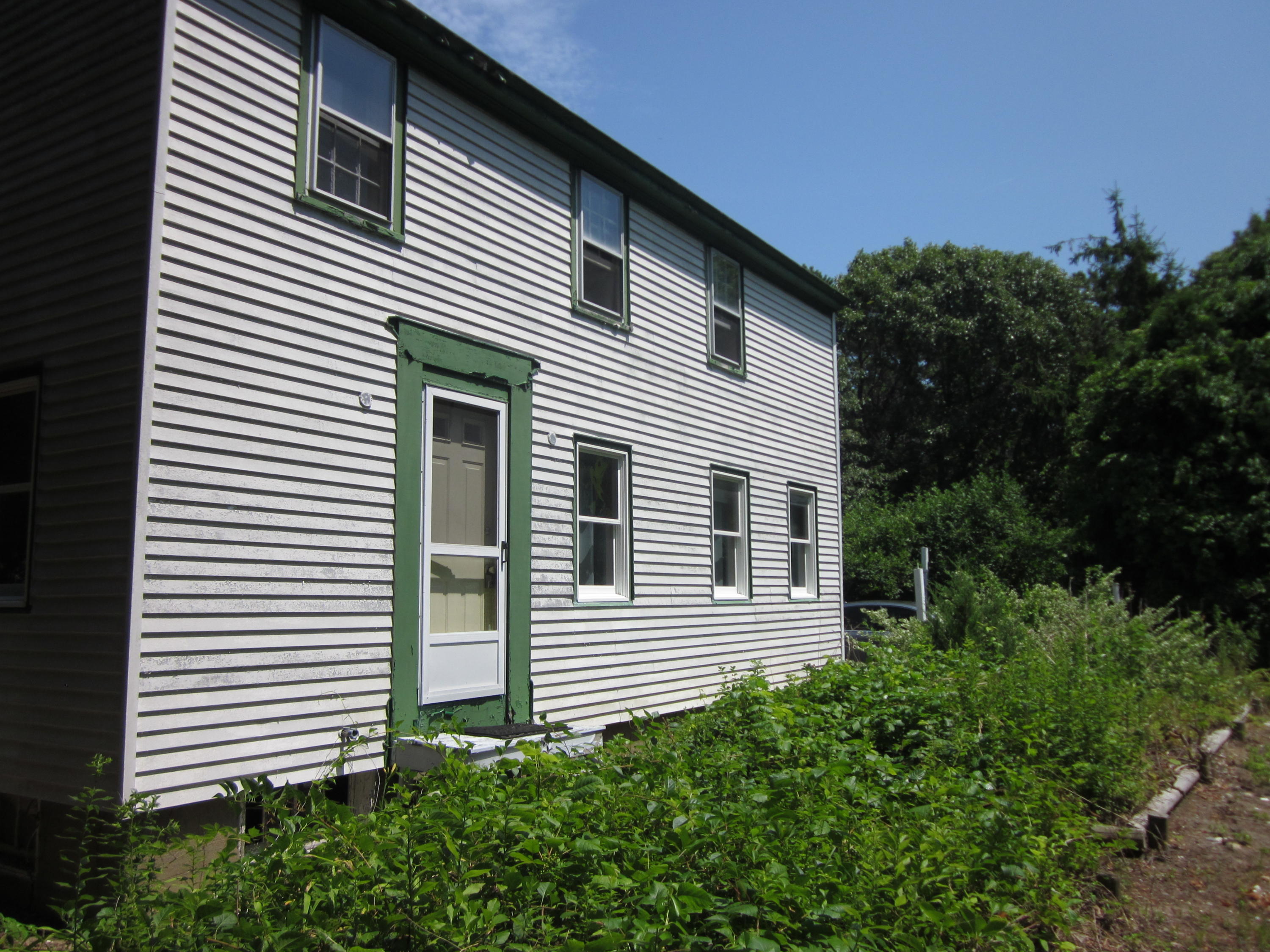 81 Shore Road Truro, MA 02666 - Photo 1 of 11 a view of a house with a yard and plants