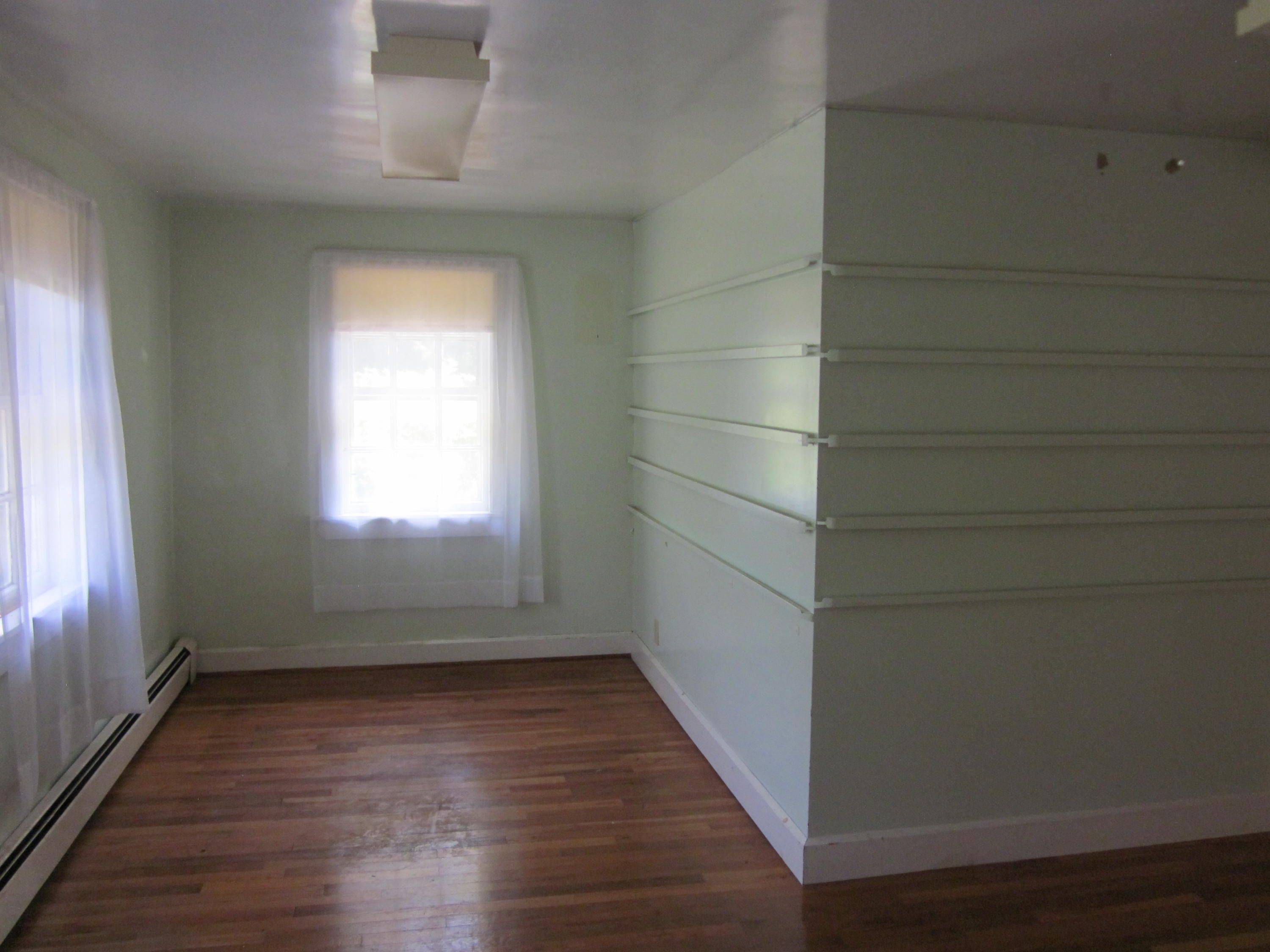 81 Shore Road Truro, MA 02666 - Photo 5 of 11 a view of a small space with wooden floor and a window