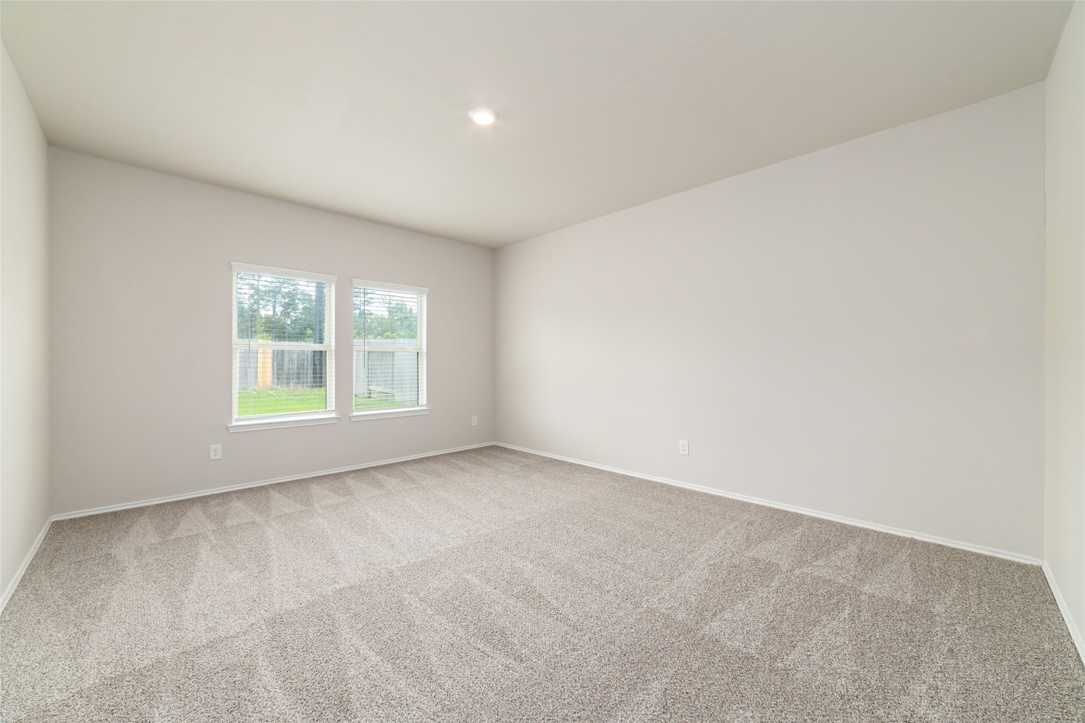 23702 Harrow Field Ln Spring Spring, TX 77373 - Photo 26 of 32 an empty room with windows