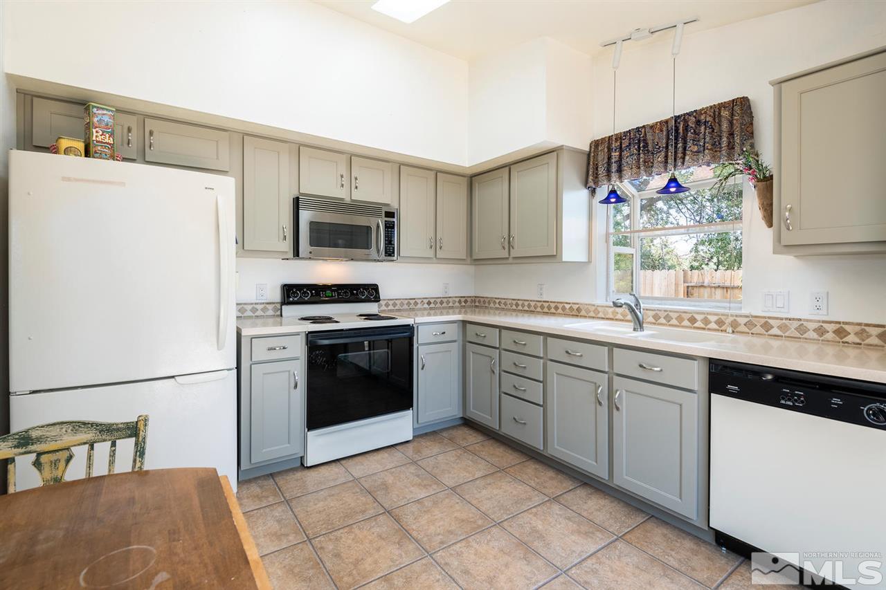 1316 Canyon Creek Road Reno, NV 89523 - Photo 8 of 17 a kitchen with a sink stove and refrigerator