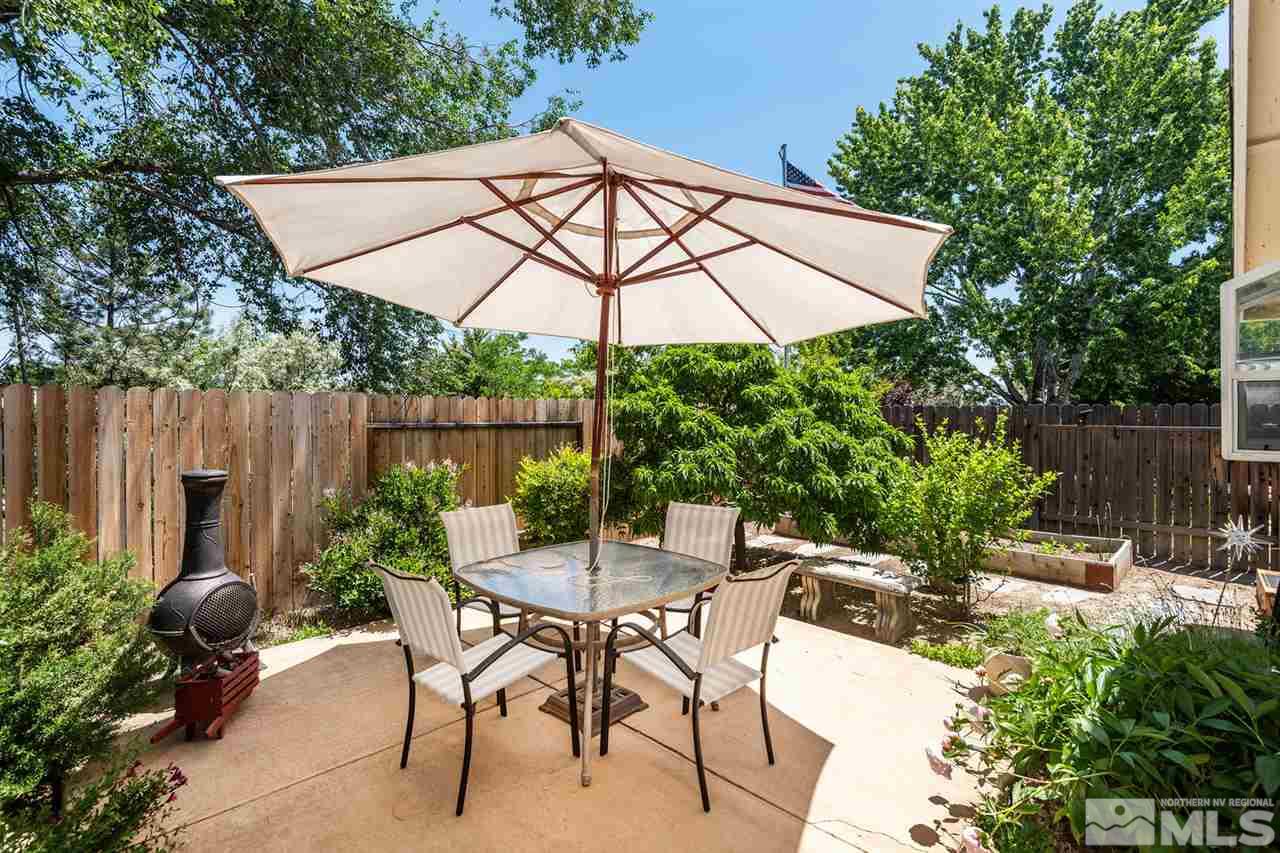 1316 Canyon Creek Road Reno, NV 89523 - Photo 9 of 17 a view of backyard with seating space and wooden fence