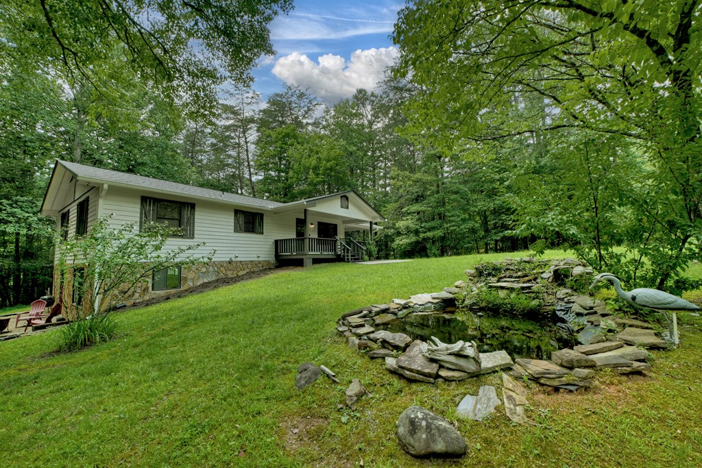 133 Yellowbird Trail Blue Ridge, GA 30513 - Photo 6 of 39 a house view with a garden space
