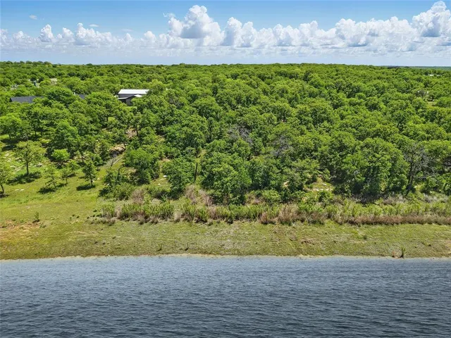 a view of a lake with a yard