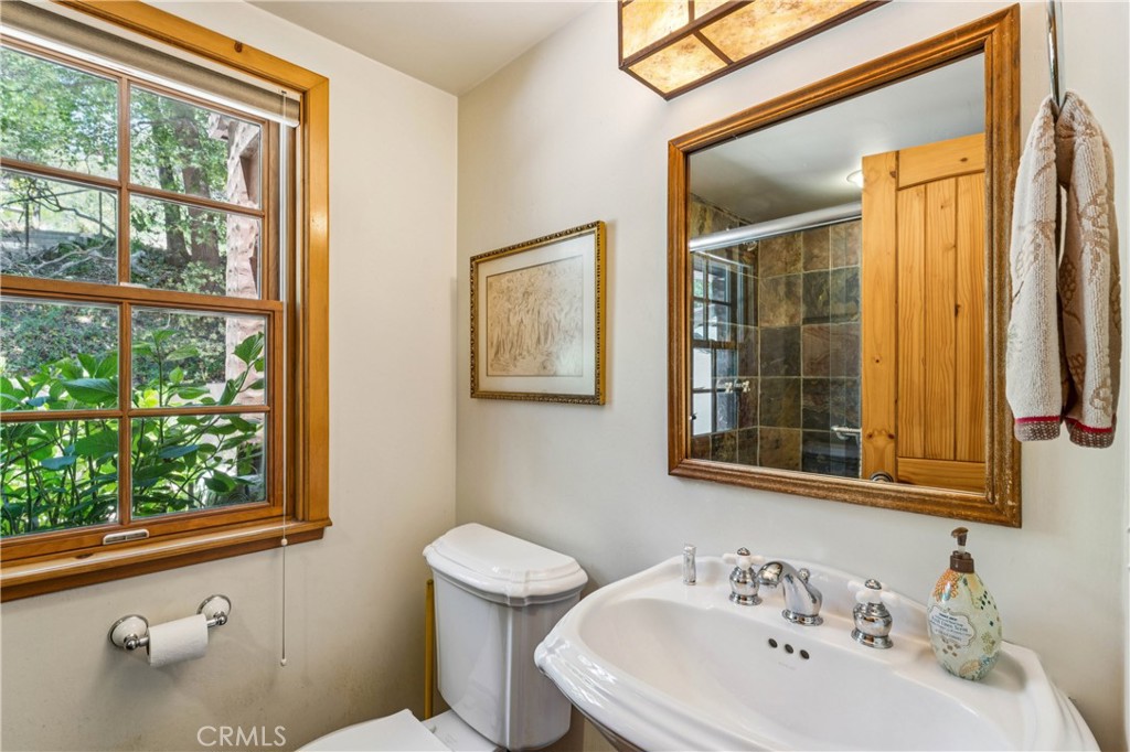 28971 North Shore Road Lake Arrowhead, CA 92352 - Photo 48 of 60 a bathroom with a sink and a window