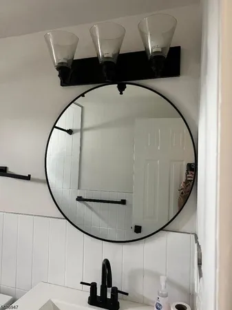 a bathroom with a toilet a sink and bathtub