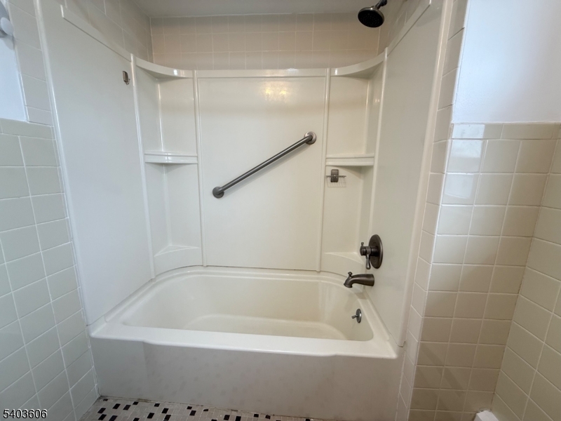 50 Buschmann Avenue, Unit 2 Haledon, NJ 07508 - Photo 9 of 11 a bathroom with a bathtub