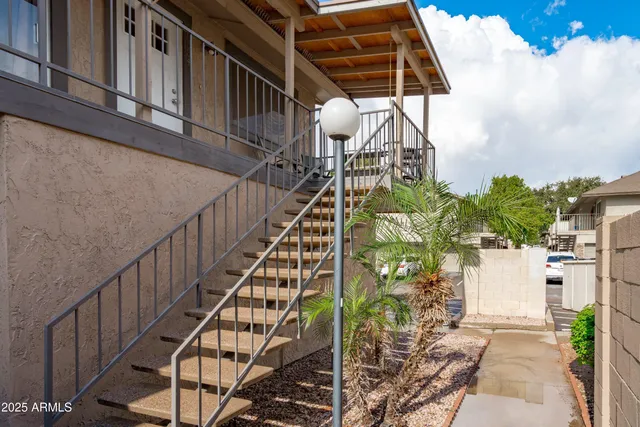 a view of entryway with wooden stairs