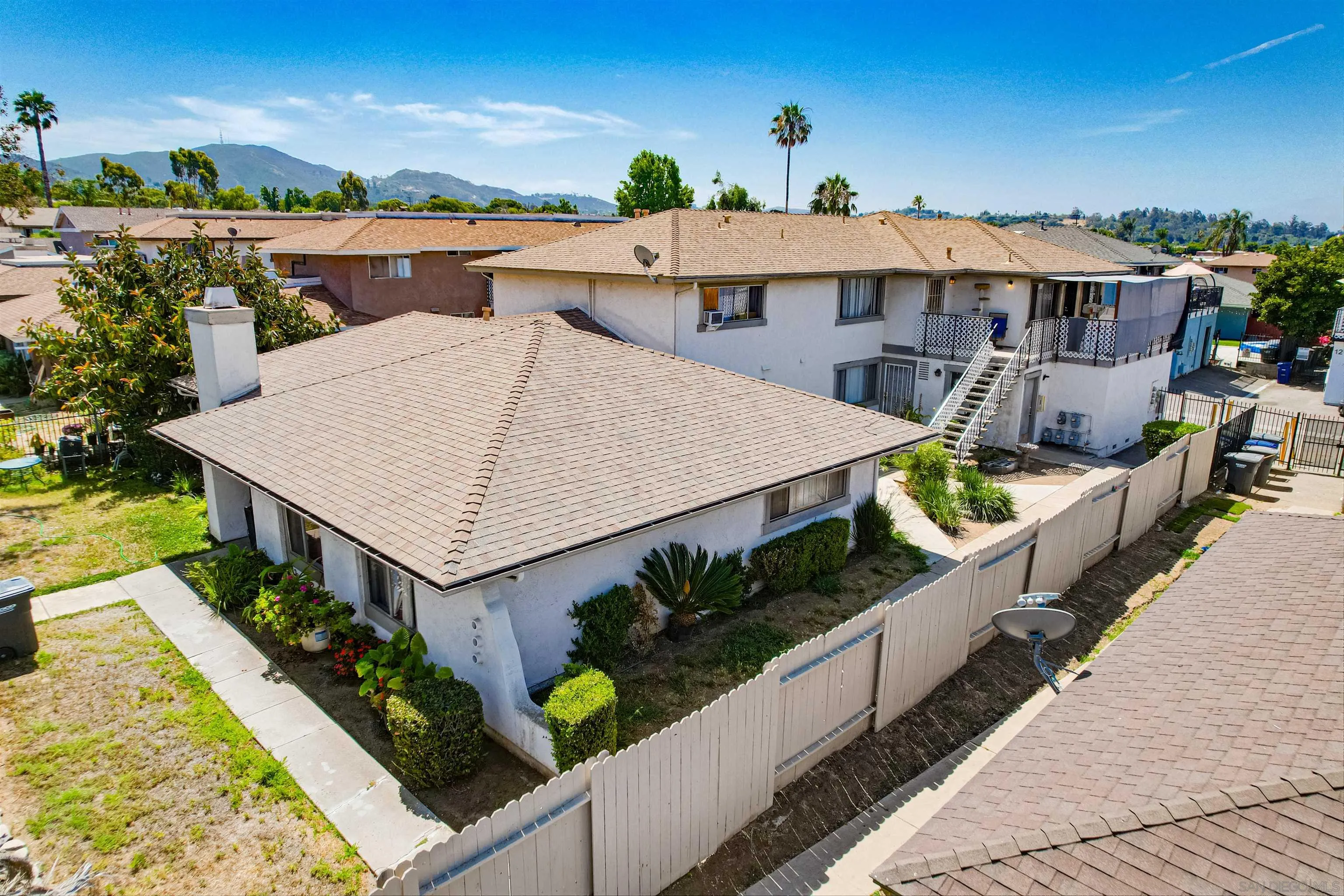 1219 Arcadia Avenue Vista, CA 92084 - Photo 1 of 7 a view of a house with swimming pool and sitting area