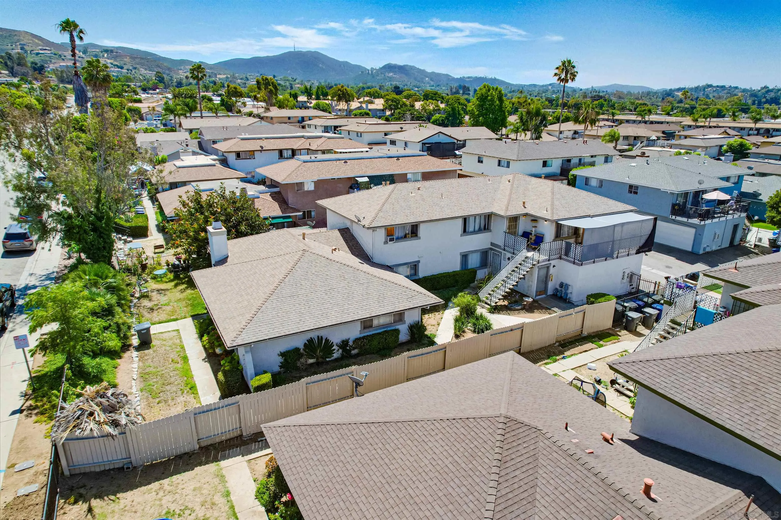1219 Arcadia Avenue Vista, CA 92084 - Photo 4 of 7 an aerial view of a house with a yard large trees and outdoor seating