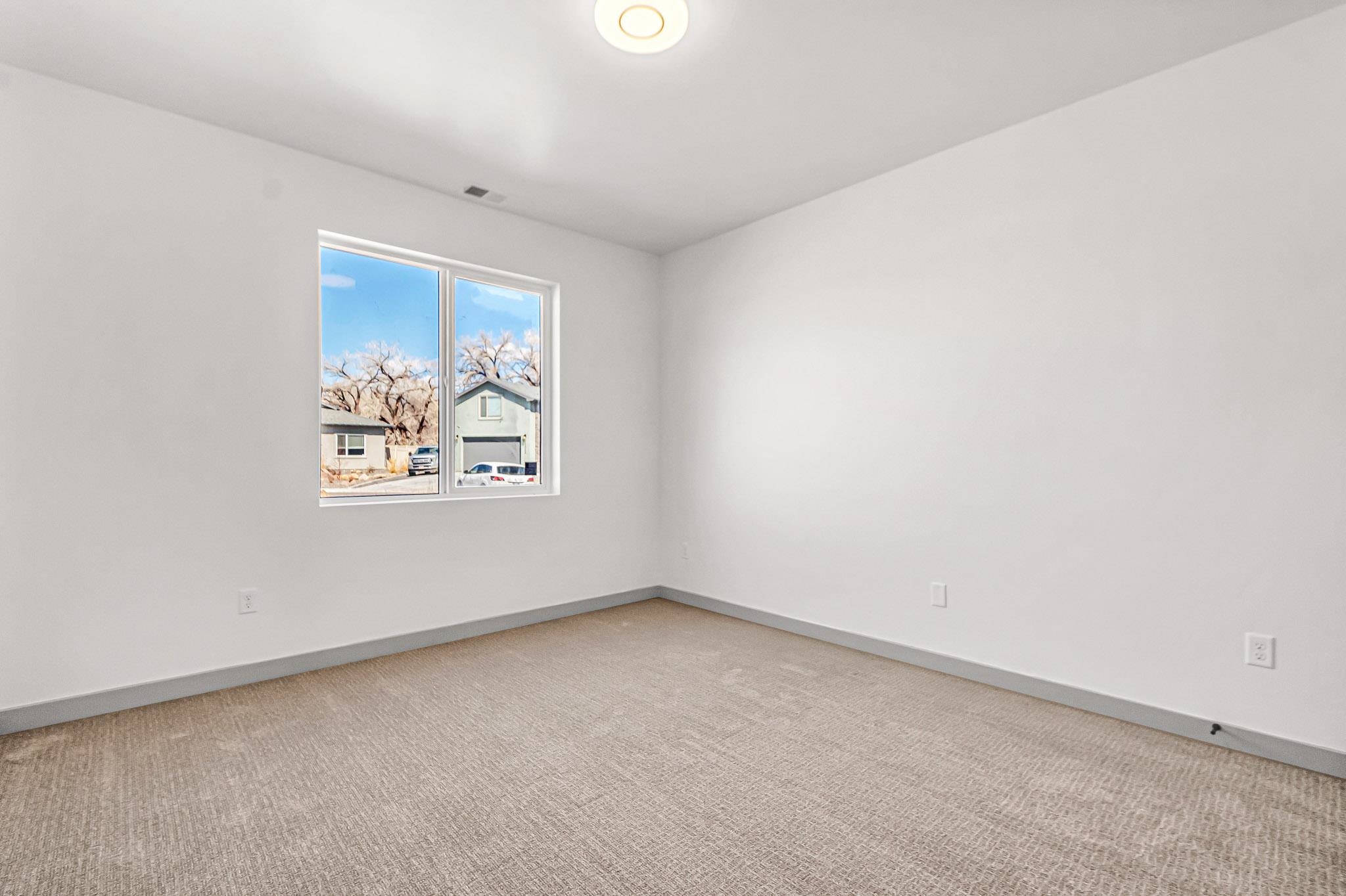 3087 Thunder Cloud Drive Grand Junction, CO 81504 - Photo 19 of 33 an empty room with a window