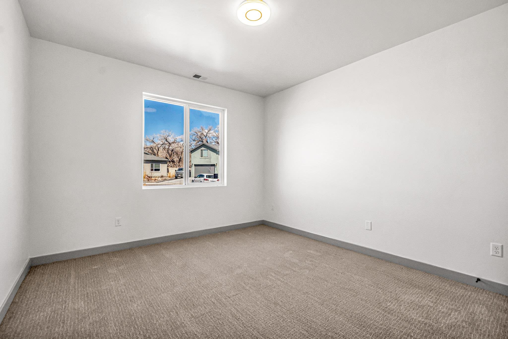 3087 Thunder Cloud Drive Grand Junction, CO 81504 - Photo 20 of 33 an empty room with windows