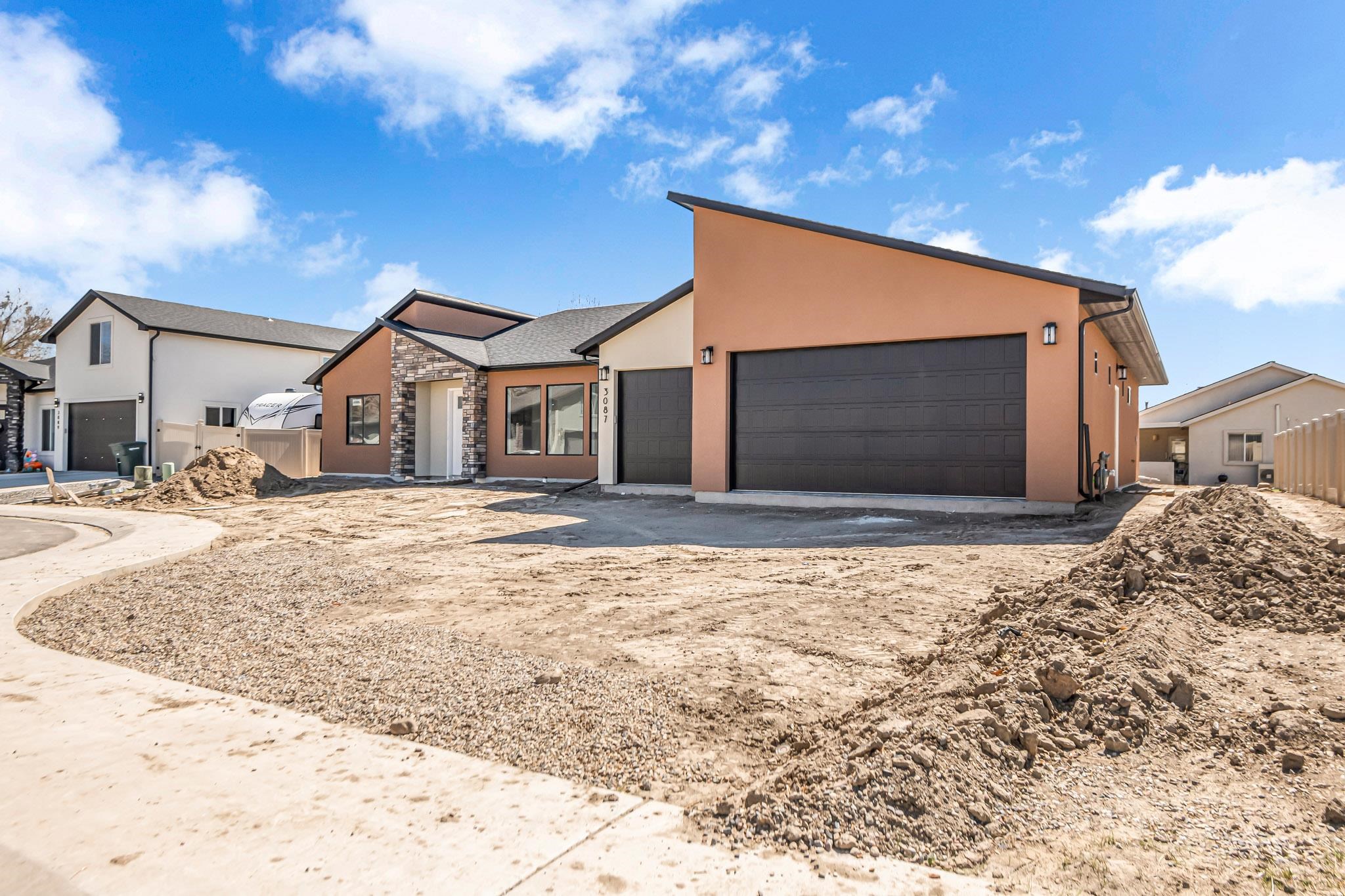 3087 Thunder Cloud Drive Grand Junction, CO 81504 - Photo 31 of 33 a front view of a house with a yard