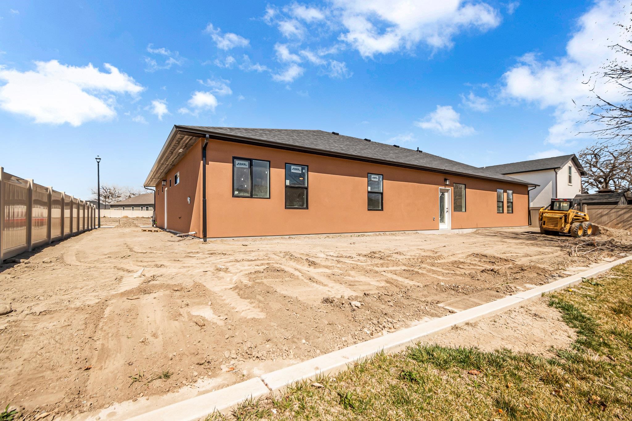 3087 Thunder Cloud Drive Grand Junction, CO 81504 - Photo 32 of 33 a front view of a house with a yard