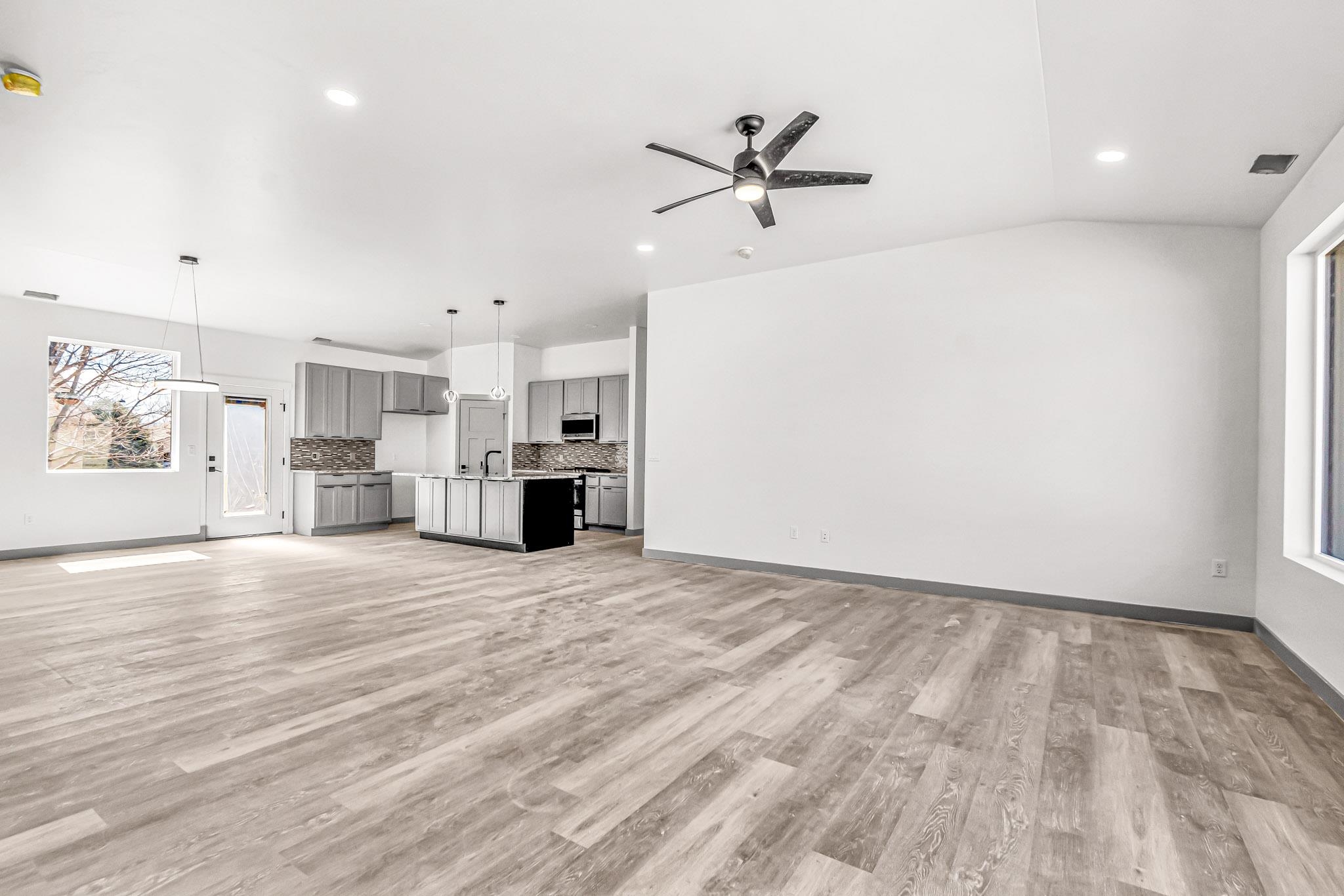 3087 Thunder Cloud Drive Grand Junction, CO 81504 - Photo 5 of 33 a view of empty room with wooden floor and window