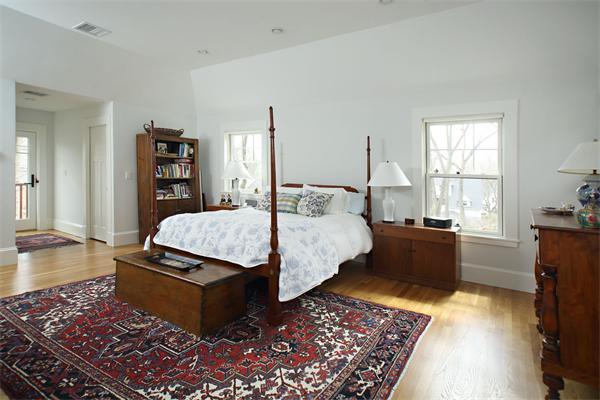 73 Oak Cliff Road Newton, MA 02460 - Photo 8 of 10 a bedroom with a bed and wooden floor