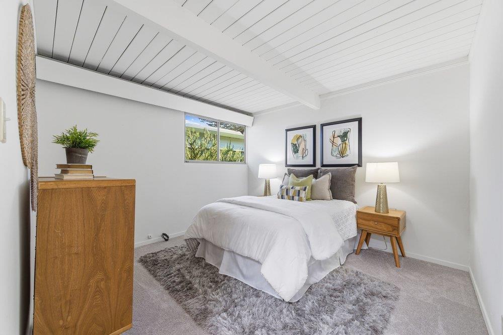 2203 Allegheny Way San Mateo, CA 94402 - Photo 15 of 56 a bedroom with a bed and a lamp on table