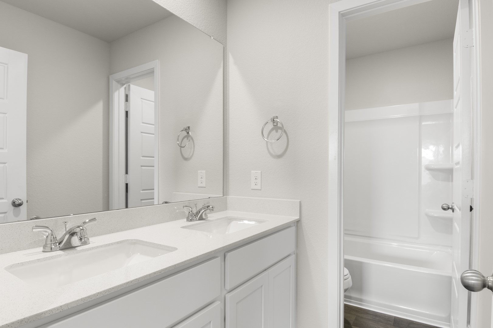 305 Jade Street Maxwell, TX 78656 - Photo 25 of 32 a bathroom with a double vanity sink and a mirror