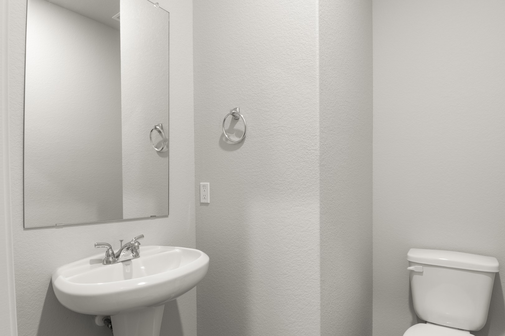 305 Jade Street Maxwell, TX 78656 - Photo 30 of 32 a bathroom with a sink toilet and a mirror