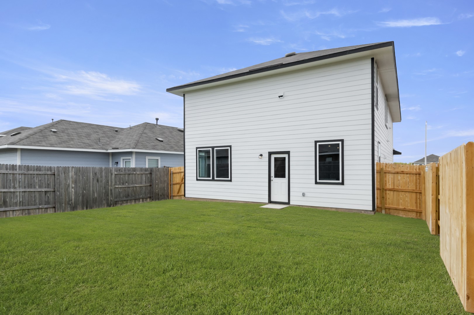 305 Jade Street Maxwell, TX 78656 - Photo 31 of 32 a view of a yard with a house