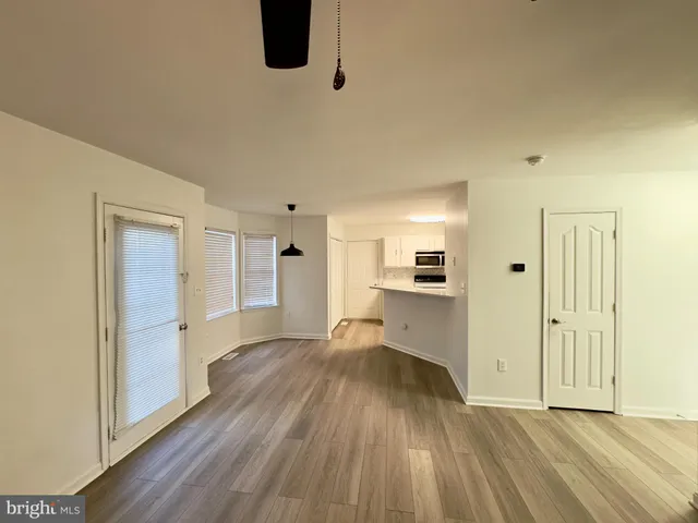 a view of a livingroom with wooden floor