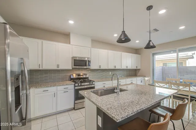 a spacious bedroom with a bed and a window