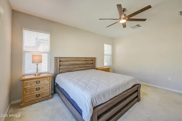 a spacious bathroom with a shower sink and mirror