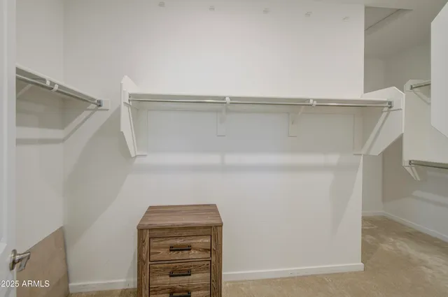 a bathroom with a shower a sink and a mirror